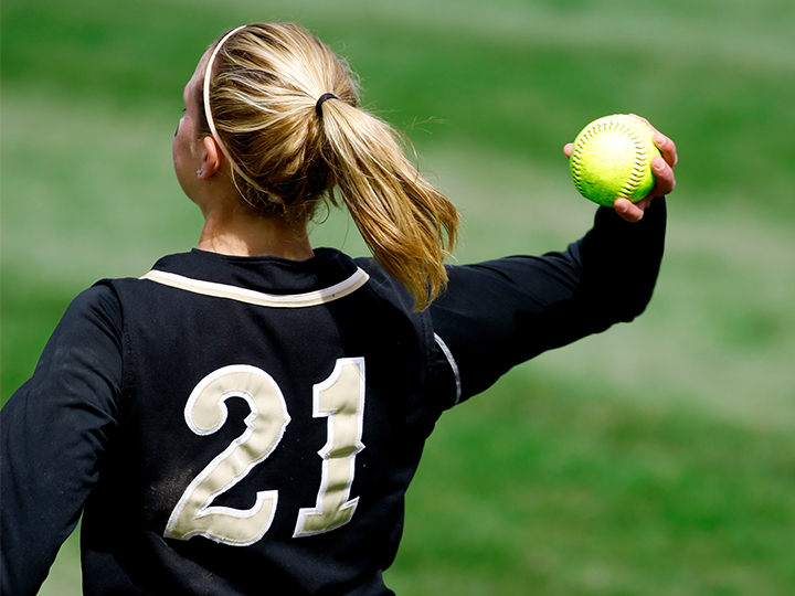 Blond girl with tennis ball in the hand