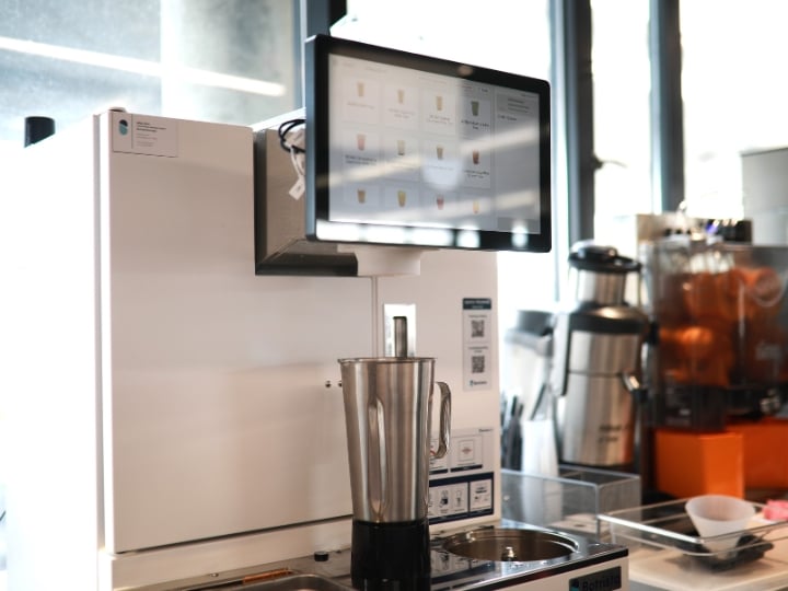 Close-up of an automated beverage machine.