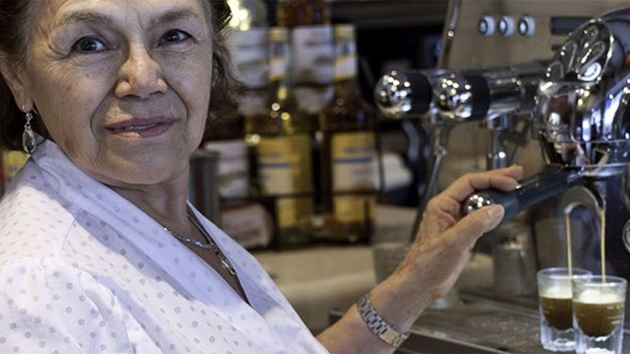 a woman serving coffee