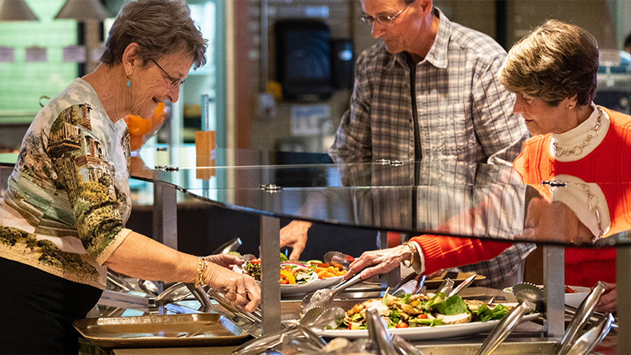 woman taking food from a table