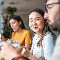 Three people eating lunch.