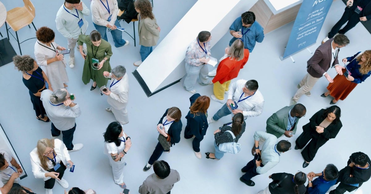 Aerial view of a diverse group of professionals networking at a business conference.