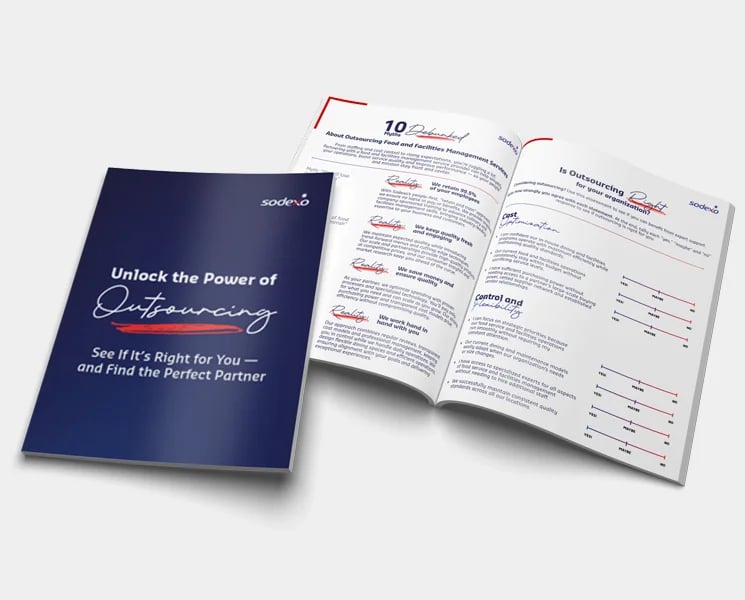 Brochure titled “Unlock the Power of Outsourcing” with open pages showing info and graphs.
