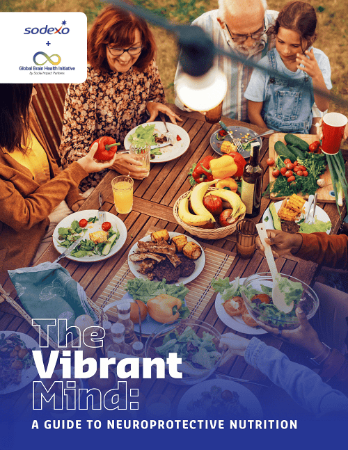 Outdoor group meal with fruits, veggies, and grilled foods promoting brain health and neuroprotective nutrition.
