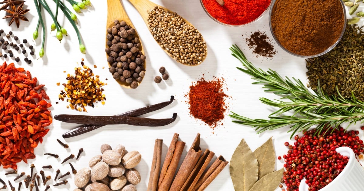 An assortment of fresh herbs and spices, illustrating the hidden allergen risks managed by RDNs in clinical nutrition. 