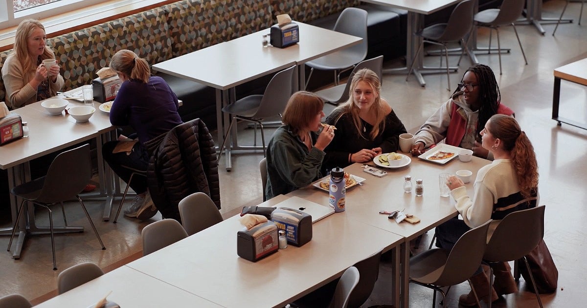 Gonzaga University dining hall with students eating and connecting.