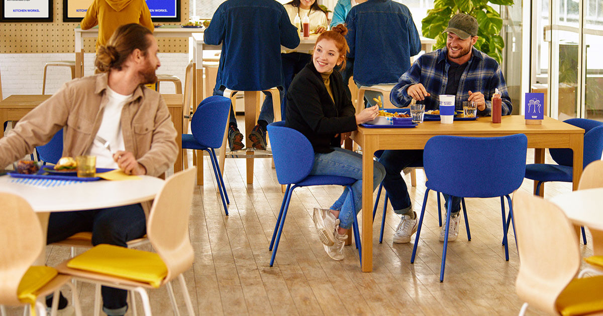 people eating in restaurant and having a friendly conversation