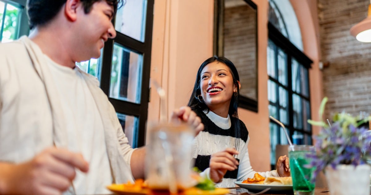 Students enjoying a meal together in a campus dining hall. 