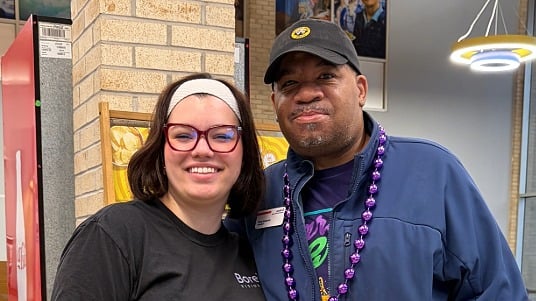Sodexo dining team member Terry Edwards and McNeese State University student Lilly Brady smiling together for a photo.