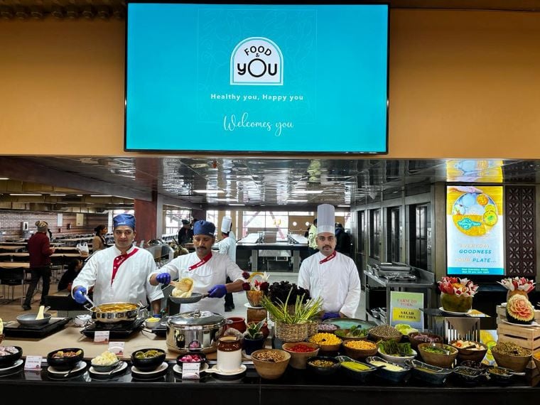 Chefs preparing a variety of dishes at the buffet