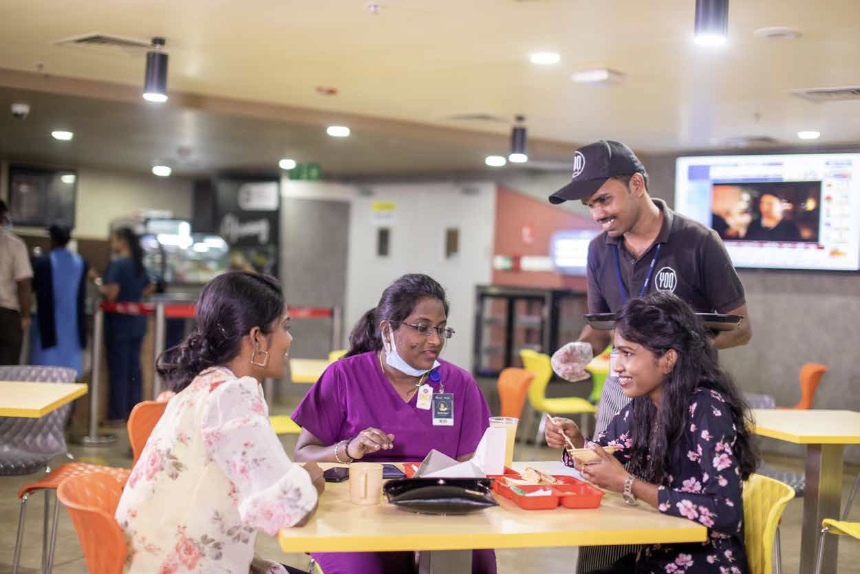 Sodexo healthcare workers sharing a meal together