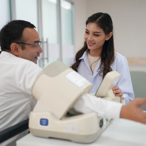 A healthcare professional testing a sphygmomanometer.