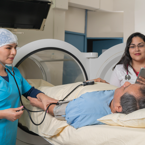 A doctor examines a man in a hospital