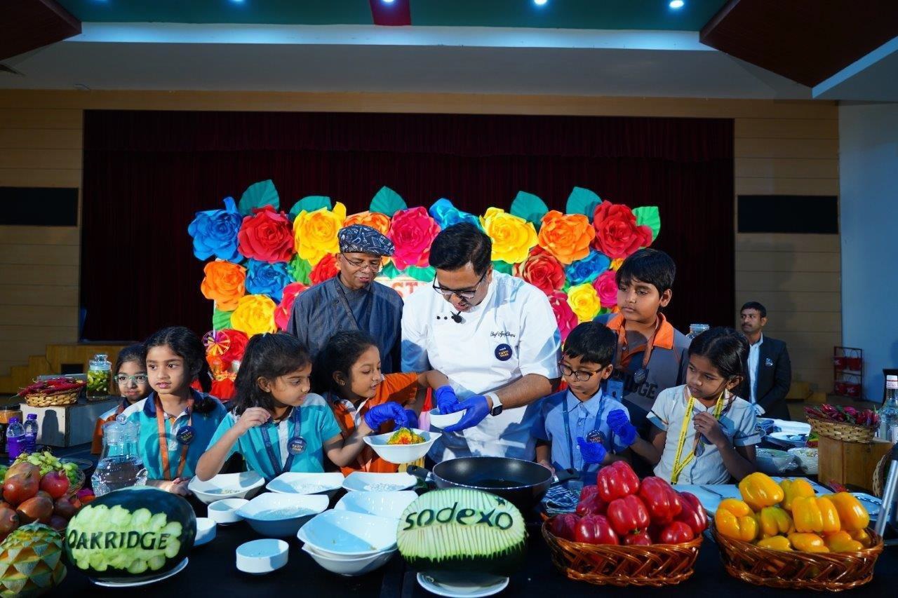 Sodexo chef conducting a culinary class for children.