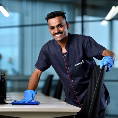 Sodexo professional sanitising a workplace