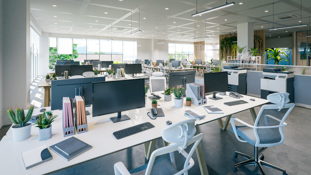 A modern office with collaborative desks and computers.