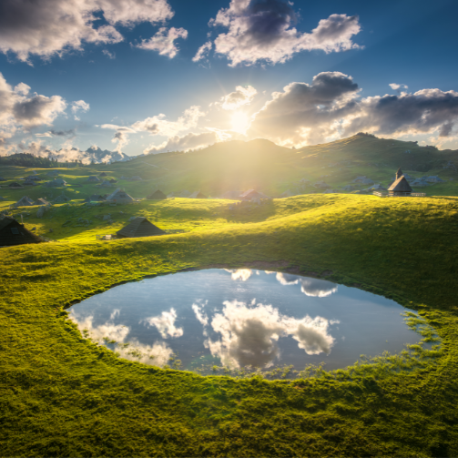 A beautiful late with the sky reflected within.