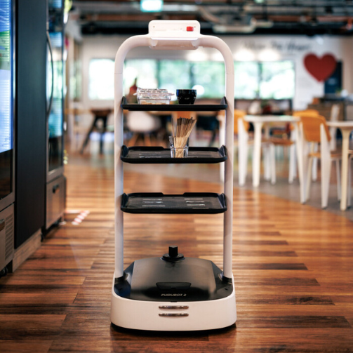 A delivery robot is carrying drinks and gliding across a wooden floor.