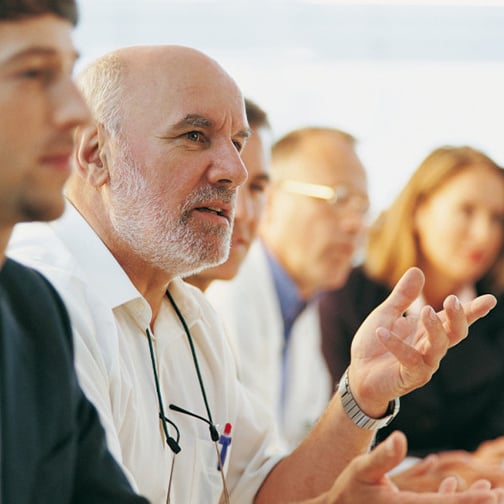 man-talking-in-meeting-503