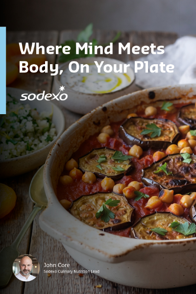Food photography of a baked aubergine and chickpea dish overlaid with the text “Where Mind Meets Body, On Your Plate” and the Sodexo logo, arranged in a vertical layout.