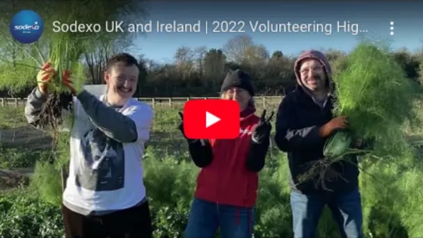 Video thumbnail of a person in a red ‘Stop Hunger’ shirt speaking outdoors on a lawn, titled ‘Sodexo Leaders Cofarm ENG ST 60 secs