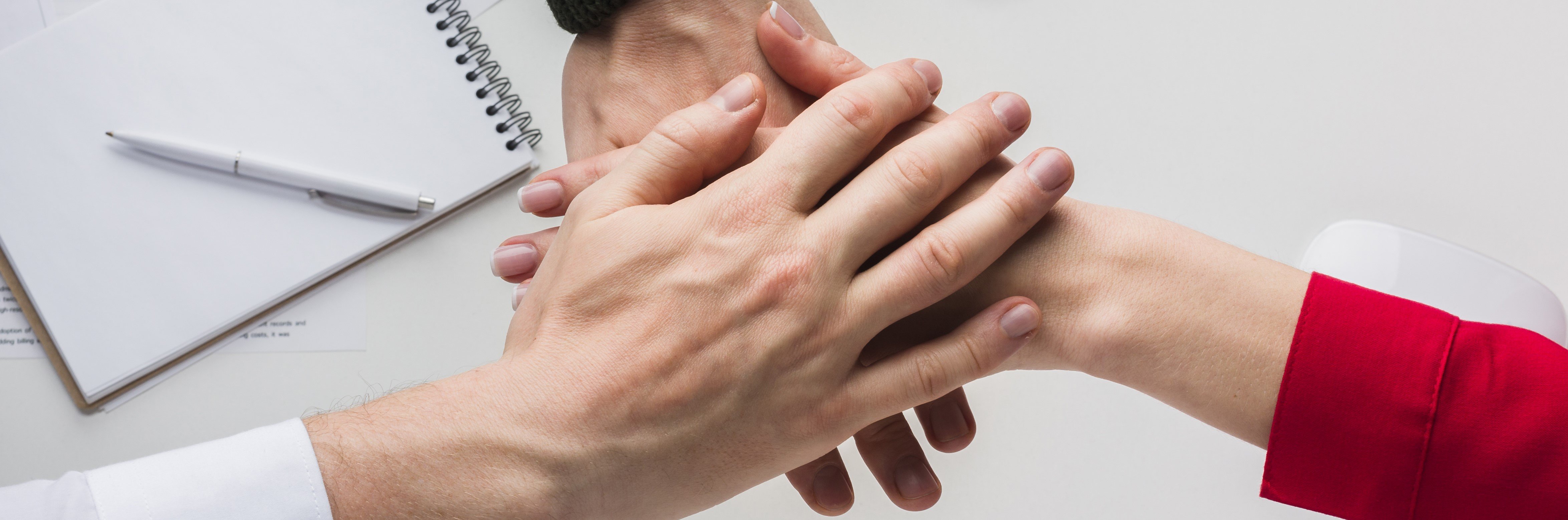top-view-hands-together-desk