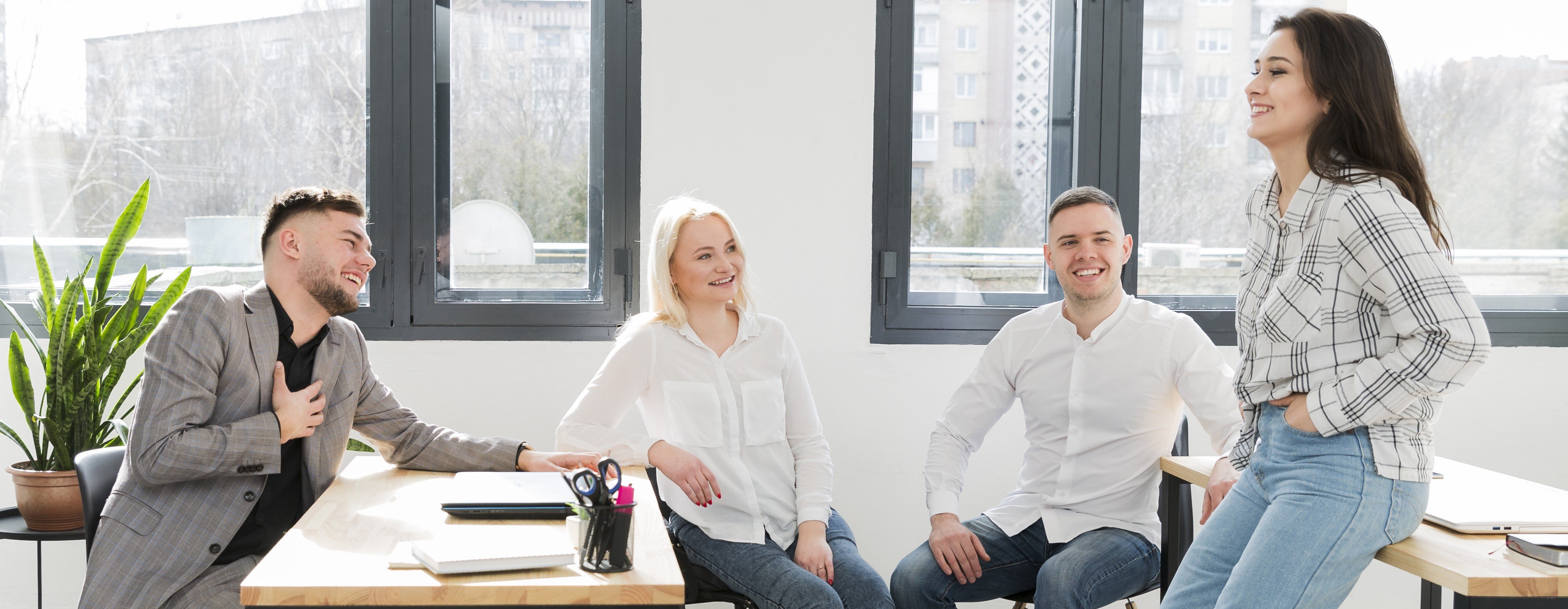 woman-wheelchair-listening-coworker-office