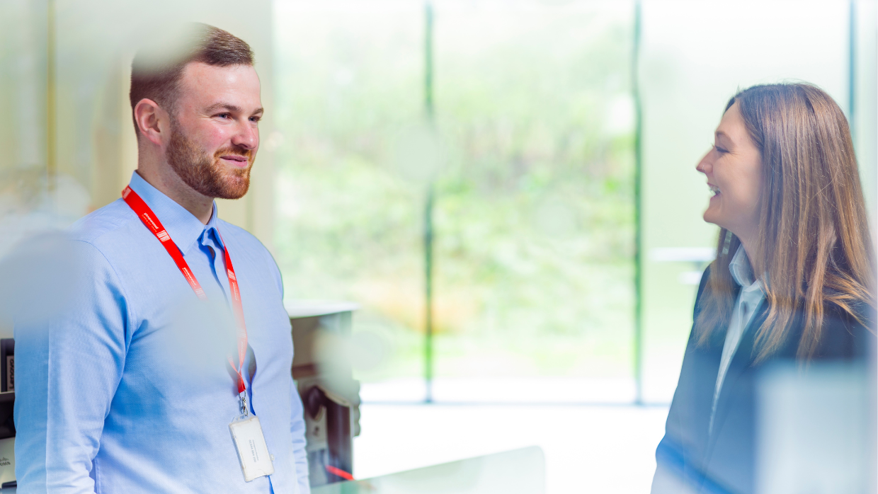 male-and-female-colleagues-chatting