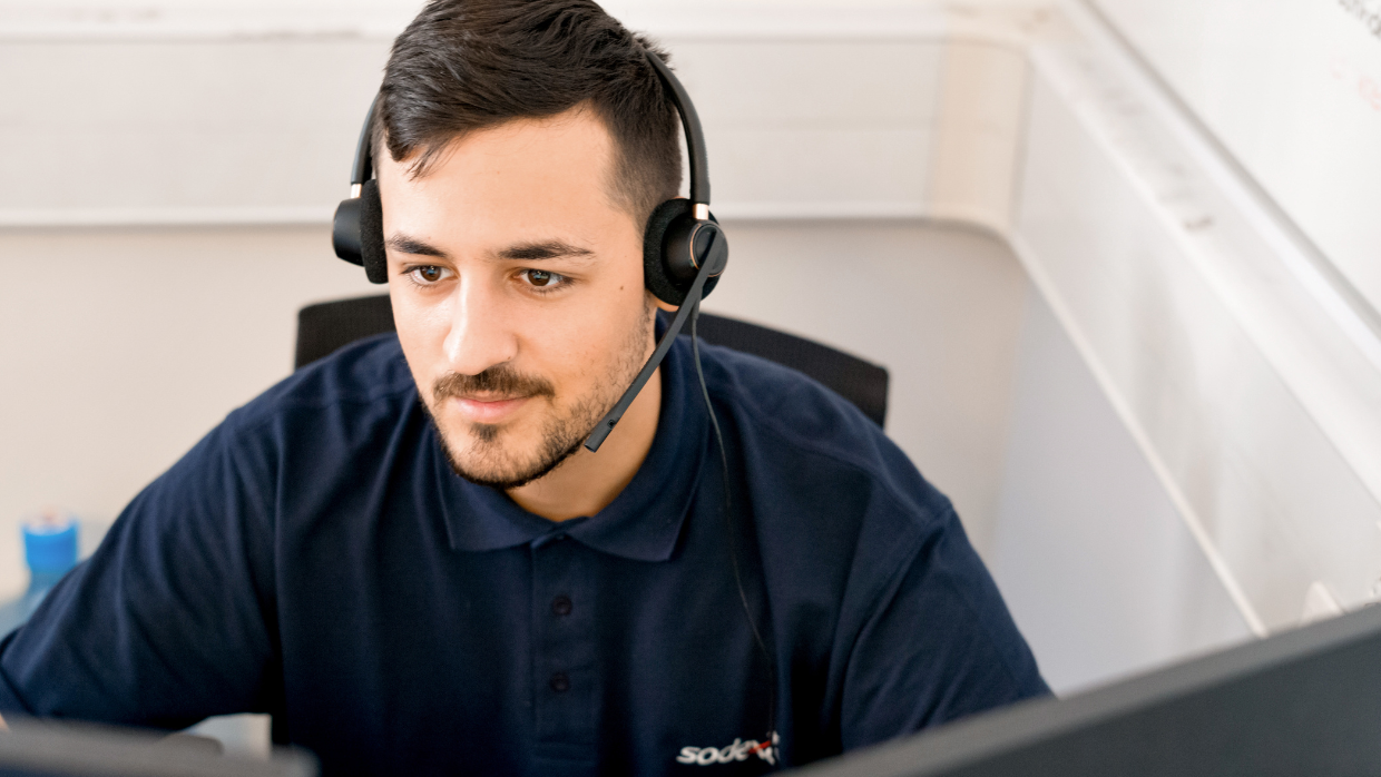 young-male-call-handler-with-headphones