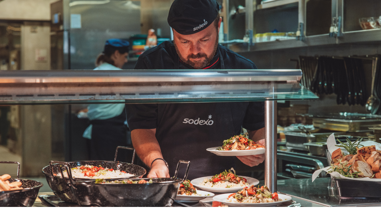 a chef serving food