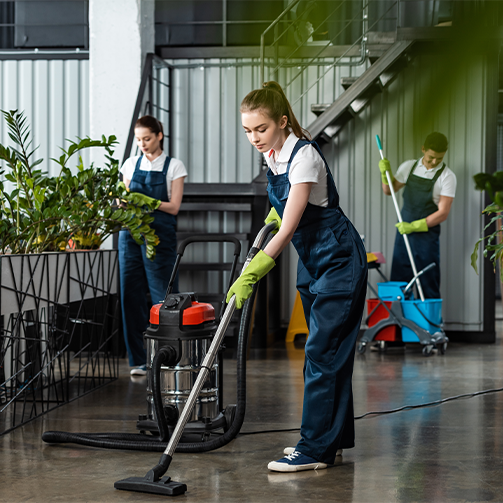 A group of people cleaning a room