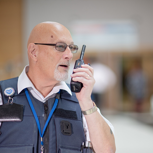 A man holding a walkie talkie