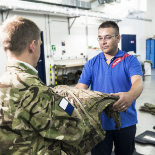 Two uniformed men engaged in conversation