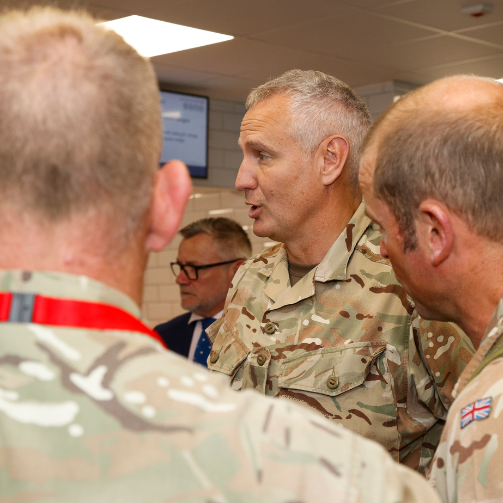 Group of three military talking