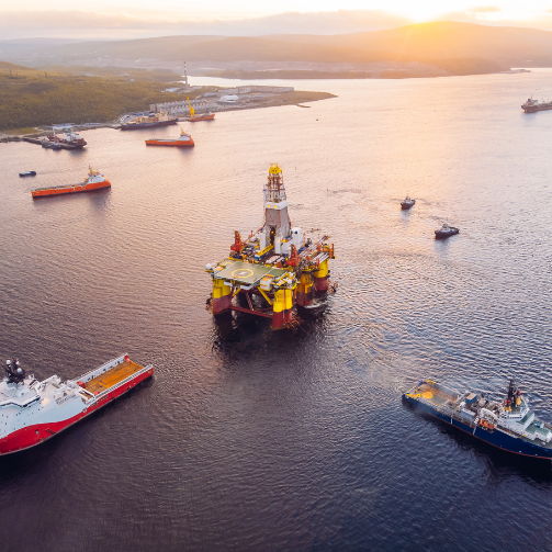 An offshore oil rig surrounded by vessels