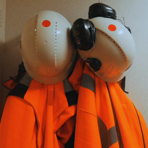Two offshore PPEs hanging with helmets
