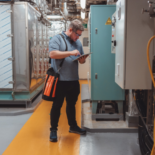 A Sodexo employee checking technical equipment