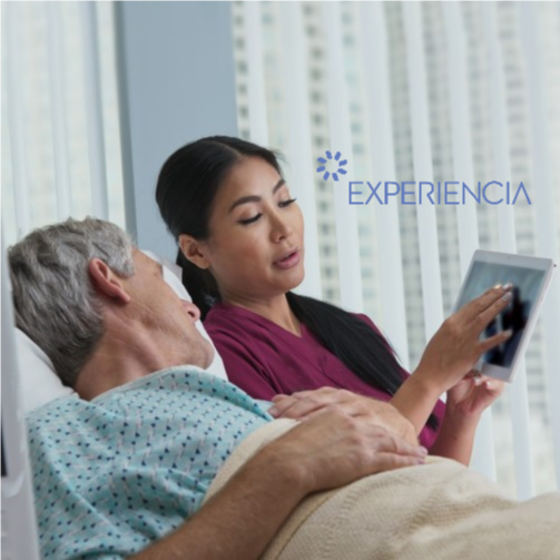 A nurse attending to a patient in a hospital room, providing care and support.