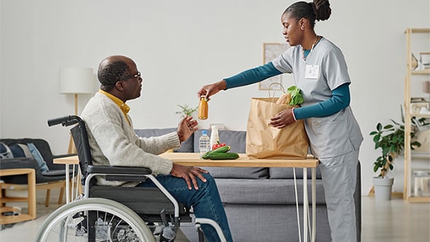 health-and-care-seniors-wheelchair-user-and-nurse-608x342