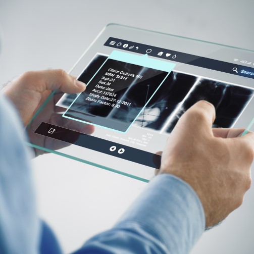 Hands holding a transparent screen