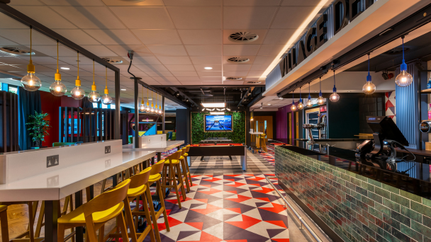 The vibrant interior of a restaurant adorned with colourful tiles