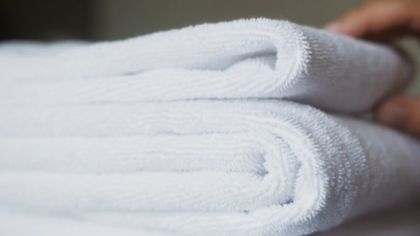 Two towels folded and white