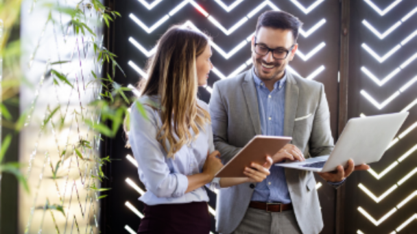 Two business people standing and talking