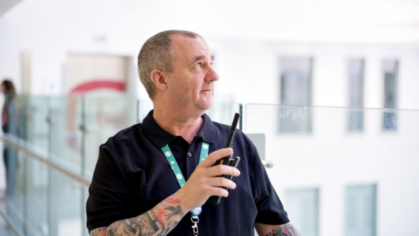 A security man using his radio transciever