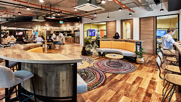 Office with large round table and bar, modern and spacious design