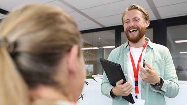  Bearded man engaging in conversation with a woman