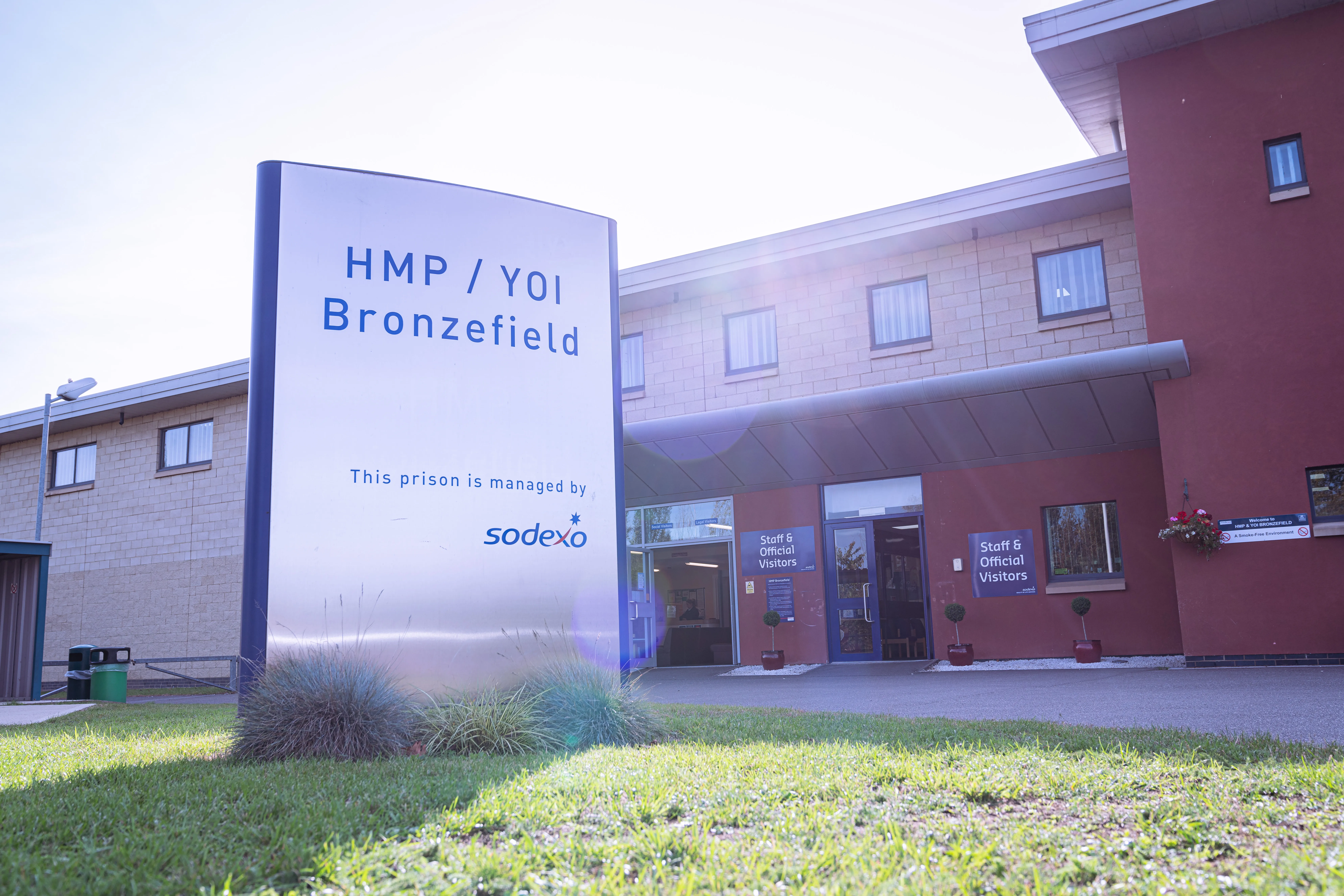 Sign for HMP/YOI Bronzefield outside the main entrance of the facility managed by Sodexo.
