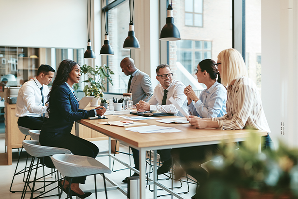 Pharma workplace with workers at a table