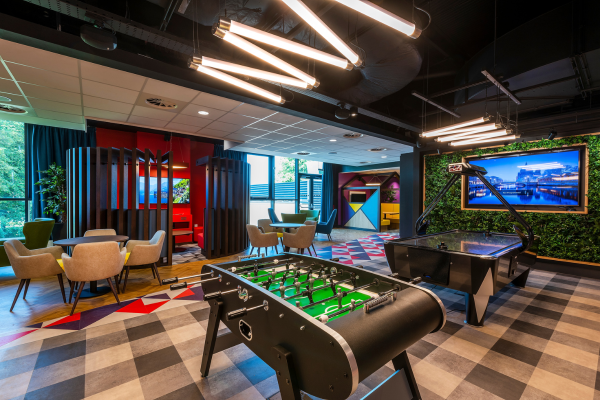 A hub with games, seating areas and televisions.