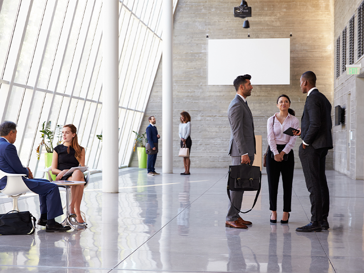 A group of people in a bright lobby